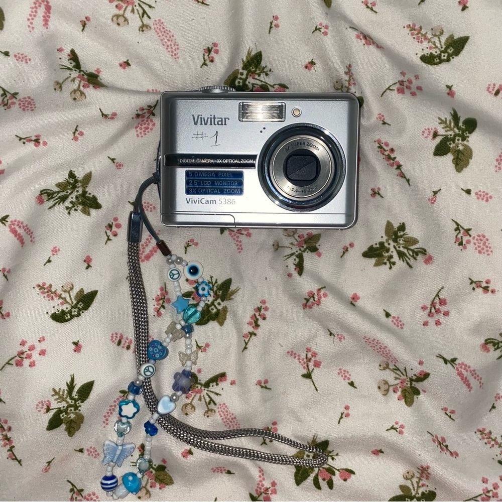 Silver and Blue Compact Digital Camera with Point-and-Shoot Lens